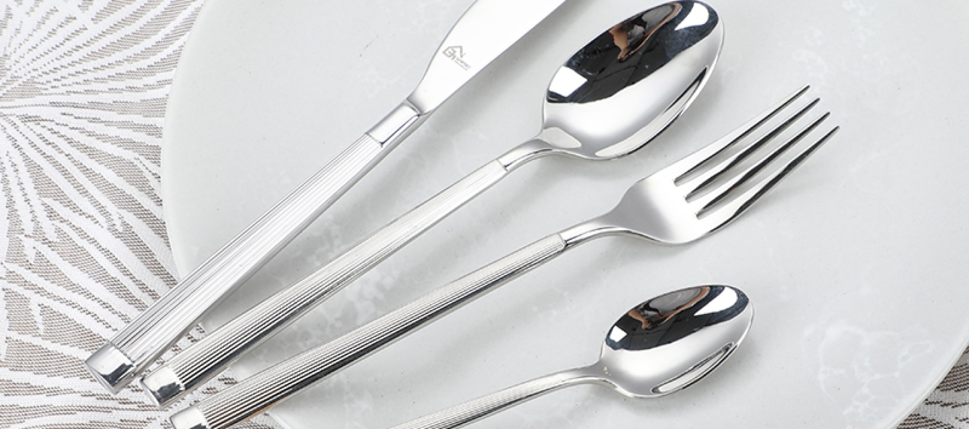 Premium stainless steel flatware on a refined dining table